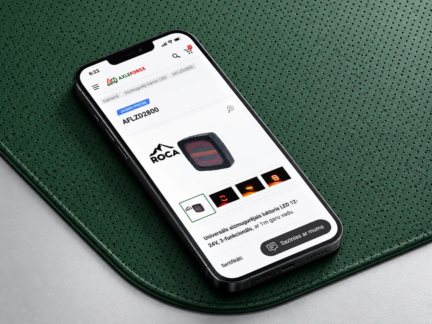 An AxleForce mobile product page on a smartphone on a green perforated surface.