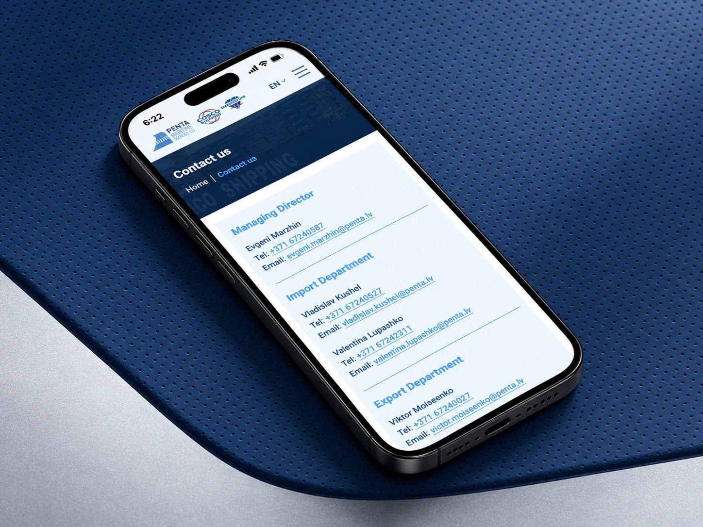 The penta.lv mobile contacts page on a smartphone on a blue perforated surface.