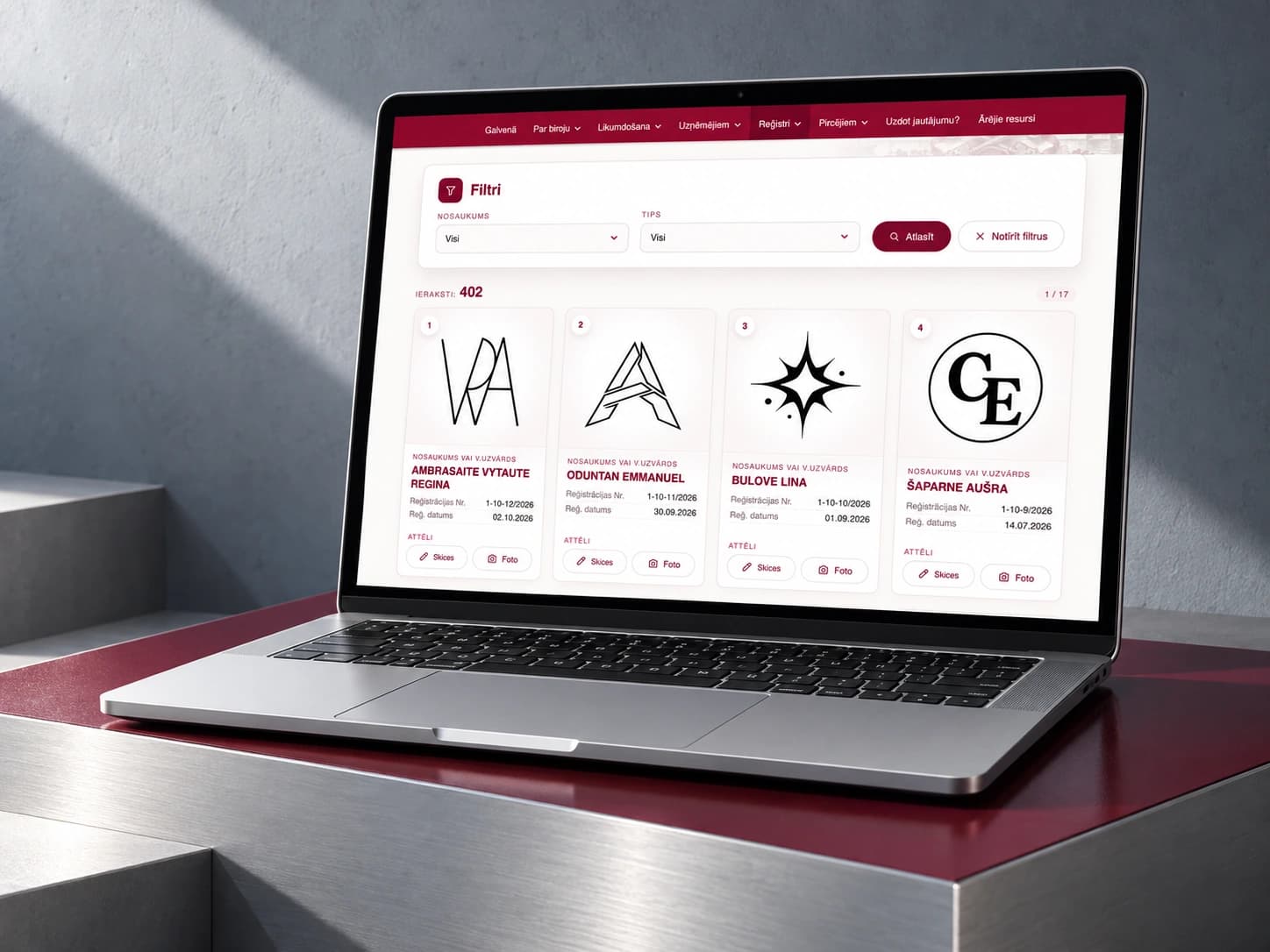 The prove.lv personal hallmark register on a laptop on a metallic plinth with a burgundy accent.