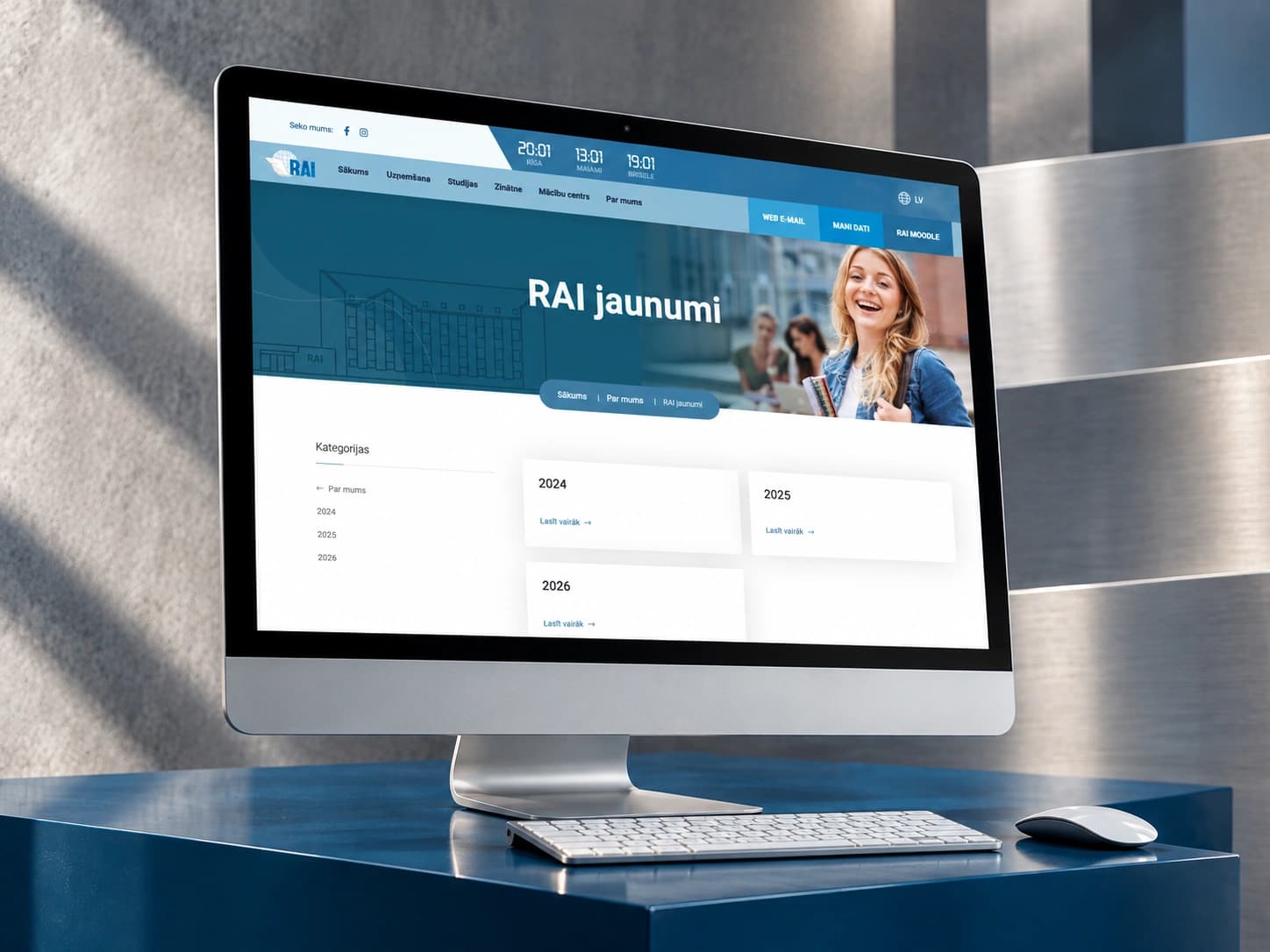 The rai.lv news archive on a monitor on a blue plinth.